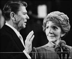 Nancy Reagan proudly watches as her husband Ronald Reagan takes the oath of office at the Capitol 