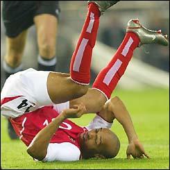 Thierry Henry tumbles after a near miss on goal
