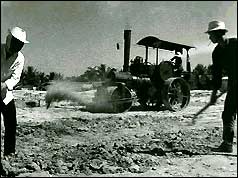 Local men preparing land for a new housing estate in Saigon