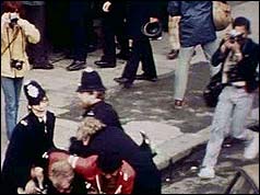 Photographers capture a scuffle between police and protesters