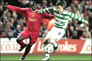 Liverpool's Emile Heskey tries to beat Alan Thompson of Celtic to the ball