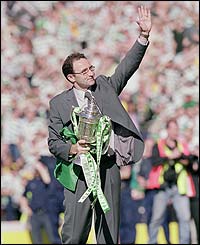 Celtic manager Martin O'Neill holds the Scottish Cup after winning it in 2001