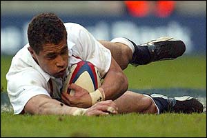 England's Jason Robinson dives over the line to score his second try against Scotland 