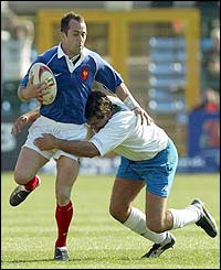 Thomas Castaignede charges through some weak Italian tackles