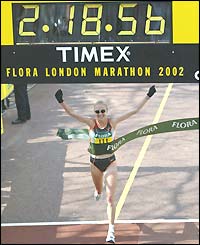 Paula Radcliffe crosses the winners line at the London Marathon in a world-record time