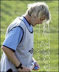 England captain David Beckham takes a drinks break