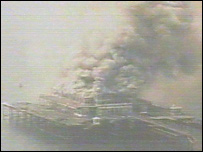 Smoke pours from the pier