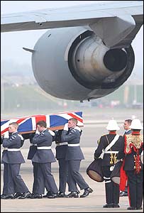 Members of the RAF seen carrying a coffin draped in the Union Jack