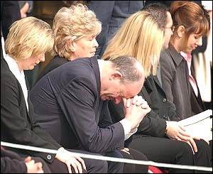 Relatives of those who died watch the ceremony at RAF Brize Norton