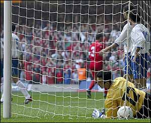 A defensive mix-up gives Wales a first minute lead 