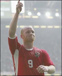 John Hartson celebrates after scoring Wales' third goal 