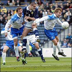 Scotland defender Lee Wilkie out-jumps the Iceland defence to head the winner