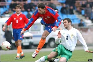 Armenia's Artur Voskanian puts Northern Ireland's Damien Johnson under pressure