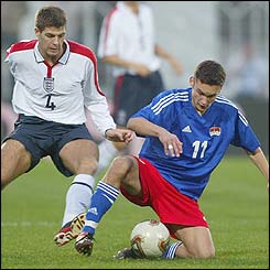 England midfielder Steven Gerrard tracks Liechtenstein's Gerster Andreas 