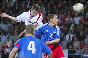 England striker Michael Owen rises highest at the near post to head England in front