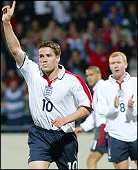 Michael Owen celebrates giving England the lead while Paul Scholes applauds his efforts