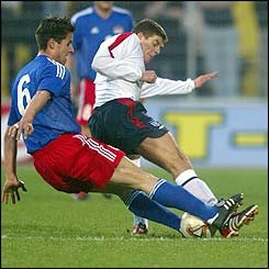 Liechtenstein's Martin Stocklasa tackles England's Steven Gerrard 