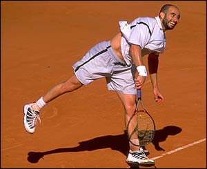 Andre Agassi powers to his first French Open title with victory against Andrei Medvedev in 1999