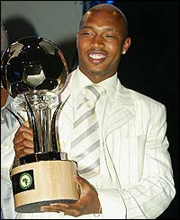 Senegal and Liverpool star El Hadji Diouf is presented with the African Footballer of the Year award for 2002