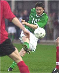 Ireland striker Robbie Keane shoots at goal 