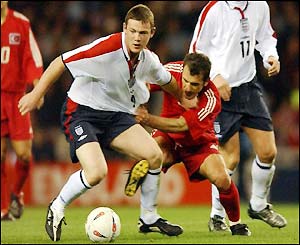 Wayne Rooney fights hard to make an impression on his England debut