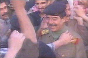 Iraqi TV picture showing Saddam Hussein being greeted by a supporter