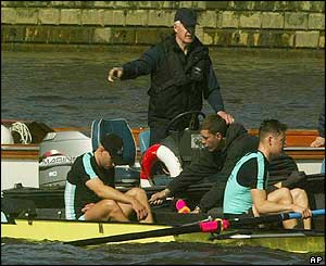 Wayne Pommen is helped from the boat after the it was involved in the collision 