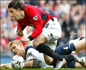 Ruud van Nistelrooy tumbles under a clumsy challenge from Sami Hyypia