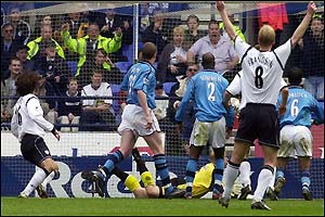 Campo heads home the winning goal from a Djorkaeff corner 