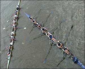 The exhausted crews lie back in their boats
