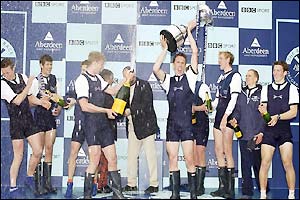Oxford president Matt Smith lifts the winning trophy