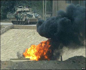 US tanks pass by the banks of the Tigris river 