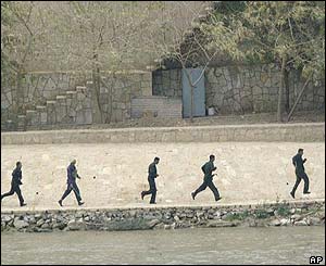 Iraqi soldiers respond to the American assault in the capital