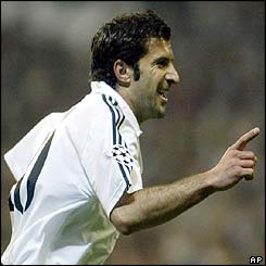 Real Madrid's Luis Figo celebrates scoring against Manchester United