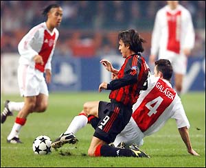 Ajax's Tomas Galasek tackles Milan's Filippo Inzaghi 