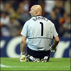 Fabien Barthez sits on his knees after Raul scores again for Real Madrid