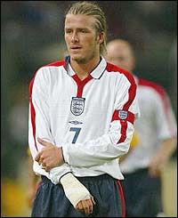 David Beckham nurses a hand injury