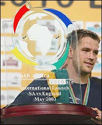 England striker Michael Owen collects a trophy after his side's win in Durban