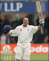 Mark Butcher celebrates scoring a century against Zimbabwe