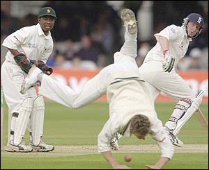 Mark Vermeulen of Zimbabwe dives for the ball as Anthony McGrath sets off for a run