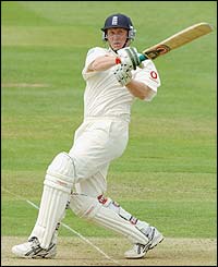 England's Anthony McGrath plays a hook shot