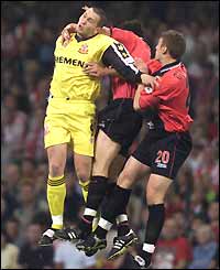 Lincoln City's Dene Cropper is thwarted by Bournemouth duo Marcus Browning and Philip Gulliver 