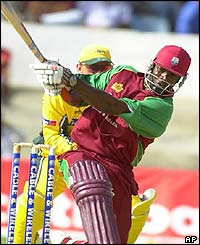 Chris Gayle of the West Indies hits a six off the bowling of Brad Hogg of Australia 