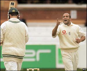 Travis Friend returns to the pavilion while Mark Butcher celebrates