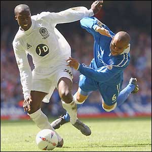QPR's Danny Gabbidon and Cardiff's Paul Furlong fight for possession