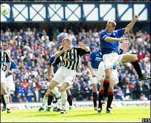 Rangers' Ronald de Boer heads in his side's fourth