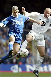 Cardiff's Graham Kavanagh fails to beat QPR's Steve Palmer to the ball