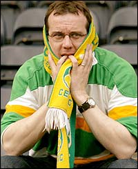 A Celtic fan at Kilmarnock sees the SPL title slipping away