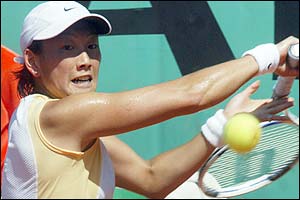 Japan's AI Sugiyama plays a sliced backhand