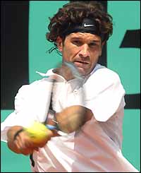 Spain's Carlos Moya beat Filippo Volandri 7-6, 4-6, 6-2, 6-3